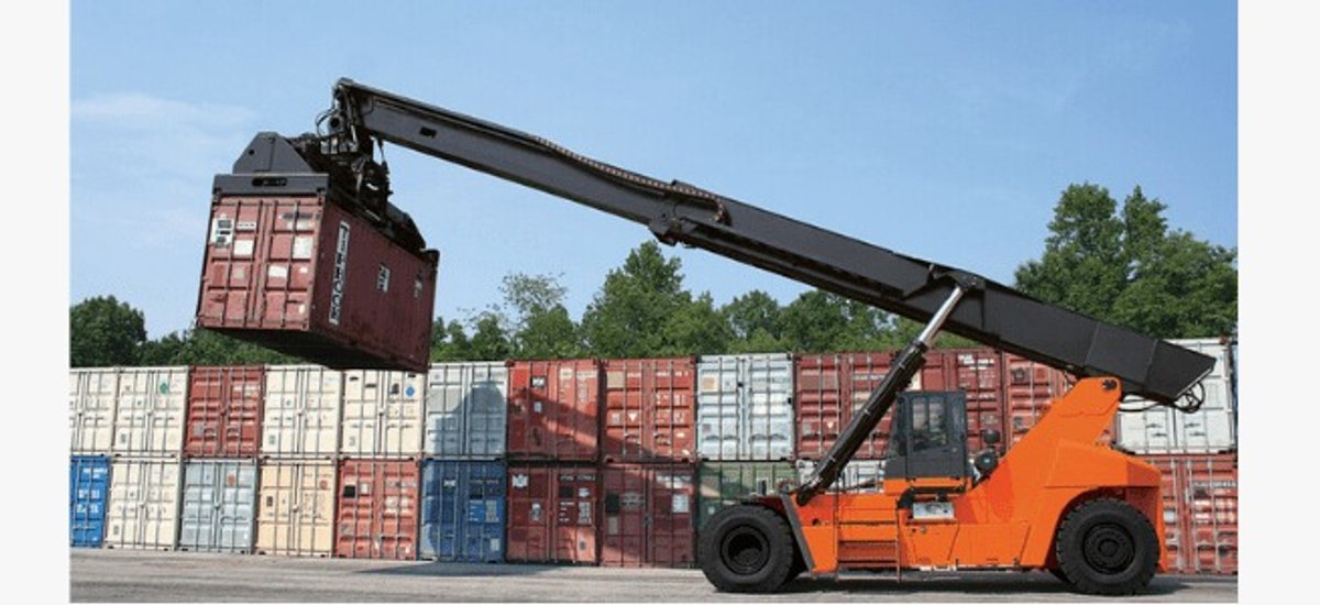 Reach stacker handling container in yard